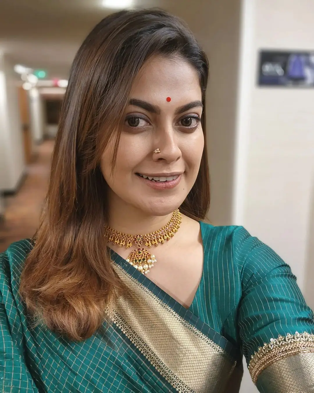 Anusree Nair Wearing Beautiful Earrings Jewellery Green Saree Blouse